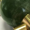 Sautoir en cuir orange, métal doré et pendentif pierre verte
