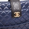 CHANEL Bag in blue quilted leather and black finishes
