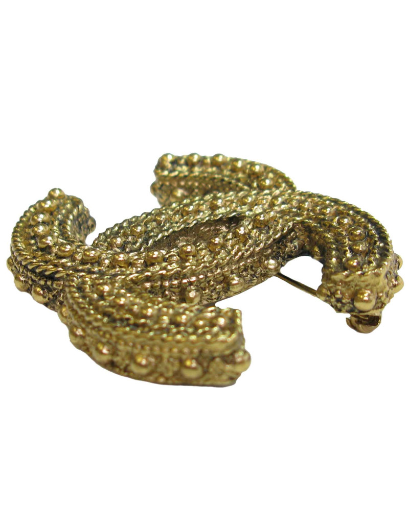 Broche CHANEL CC en métal doré vieilli