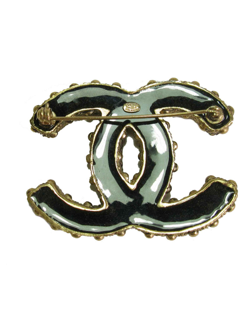Broche CHANEL CC en métal doré vieilli