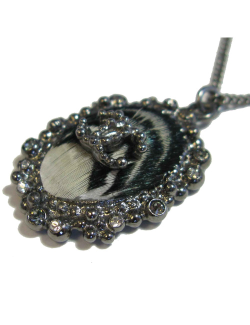 CHANEL pendant necklace in silver plated metal and feather