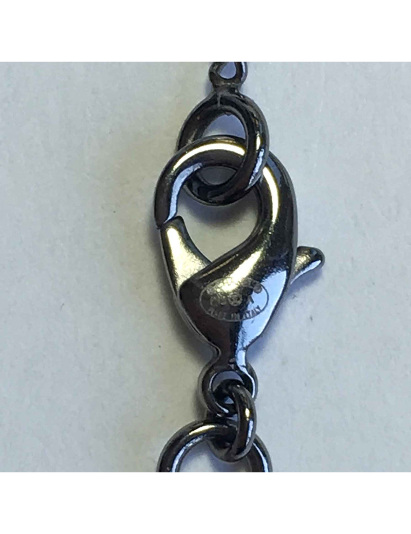 Collier CHANEL en métal argenté et plume