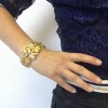 GOOSSENS cuff bracelet in transparent plexiglass and gilt metal