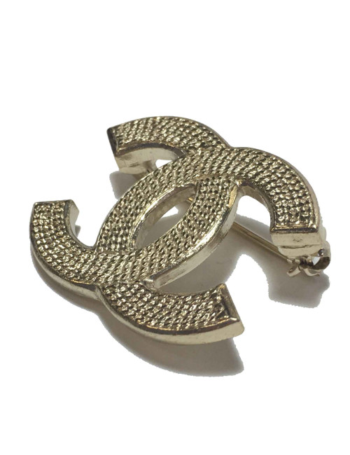 Broche CC CHANEL en métal doré