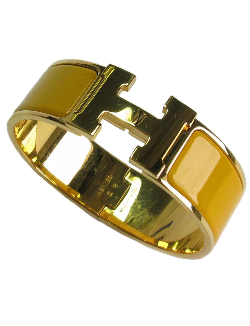 Bracelet Clic Clac HERMES en émail jaune, plaqué or