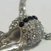 Collier CHRISTIAN LACROIX en métal argenté pendentif serti de brillant et perles noires