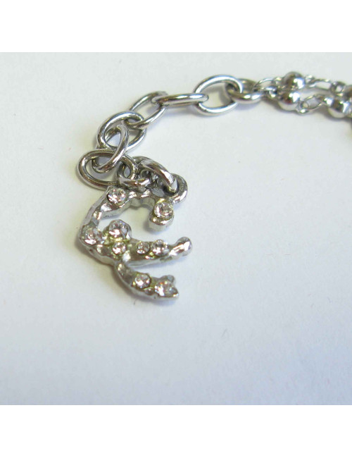 Collier CHRISTIAN LACROIX en métal argenté pendentif serti de brillant et perles noires