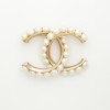 CHANEL CC Brooch in pale gilded metal fully beaded with pearls