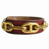 Bracelet HERMES en cuir bordeaux et chaîne d'ancre métal doré