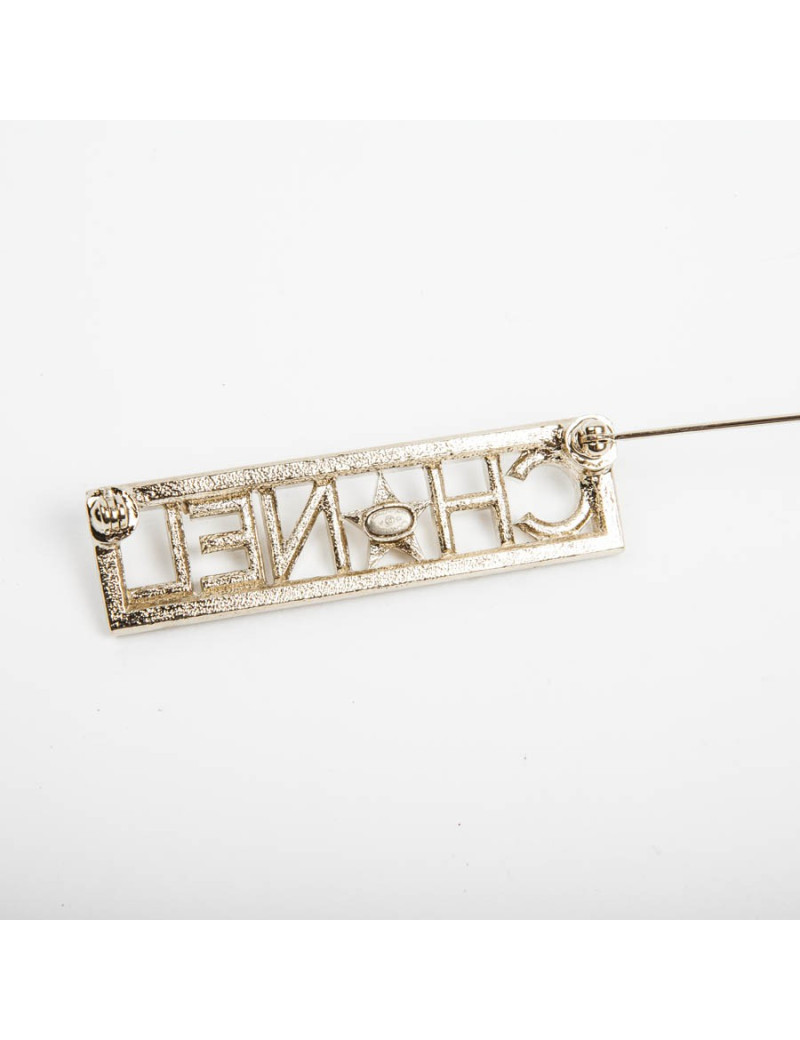 Broche "Paris-Dallas" avec strass