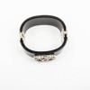 CHANEL cuff bracelet in black plexi and CC in freshwater pearls