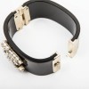 CHANEL cuff bracelet in black plexi and CC in freshwater pearls