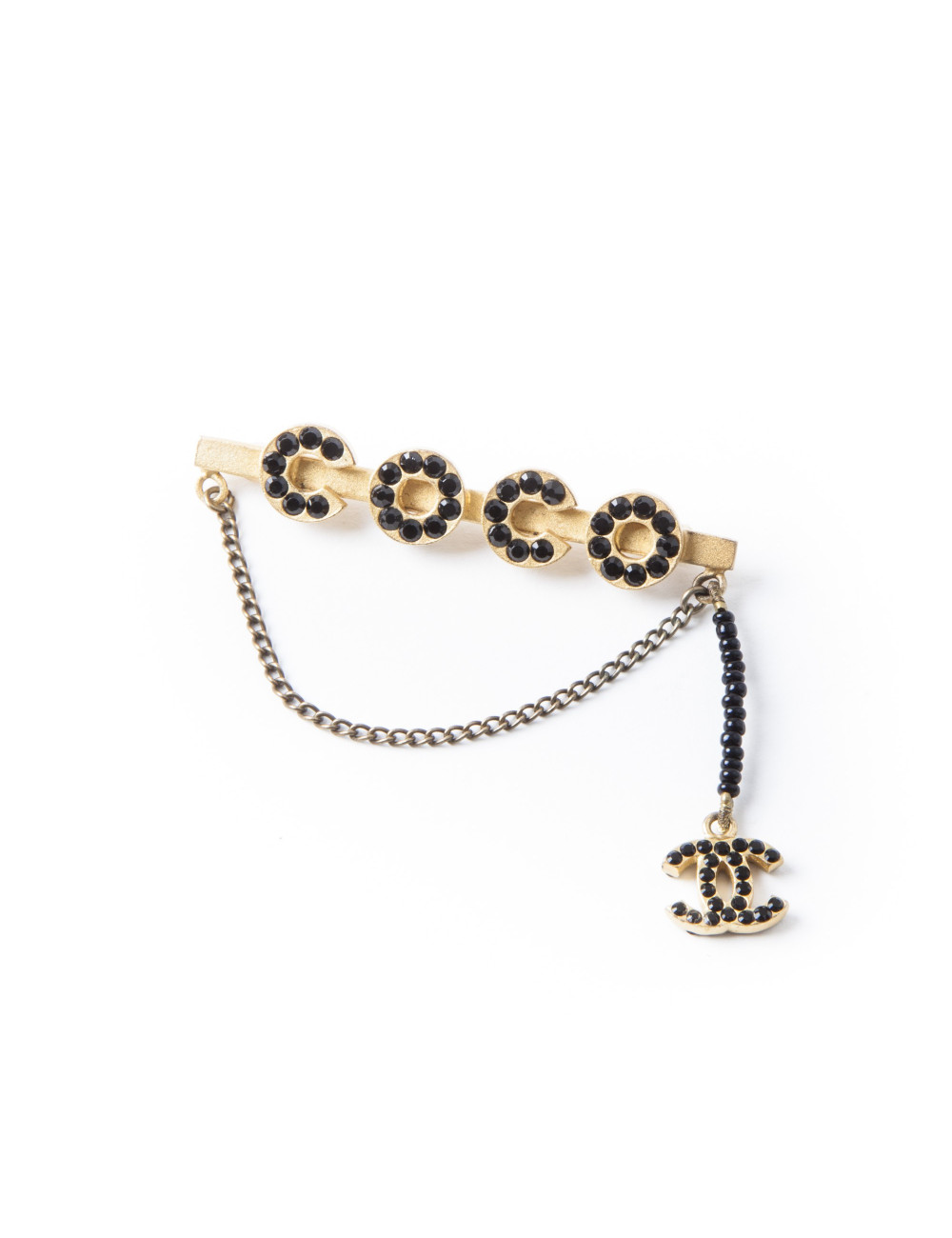 Broche Coco CHANEL dorée avec perles noires
