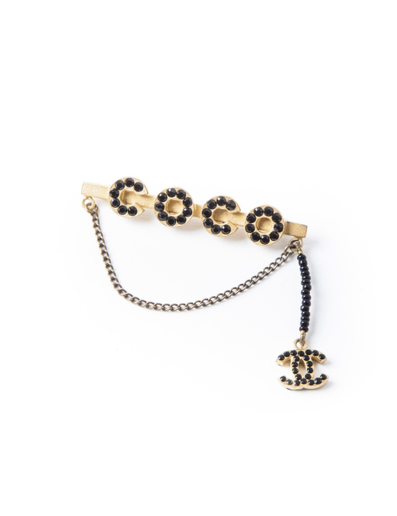Broche Coco CHANEL dorée avec perles noires