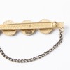  CHANEL 'COCO' brooch in matt gilded metal and black rhinestones