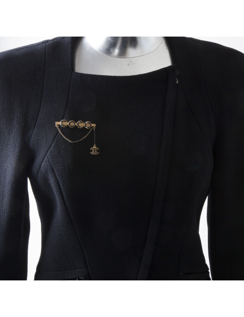  CHANEL 'COCO' brooch in matt gilded metal and black rhinestones