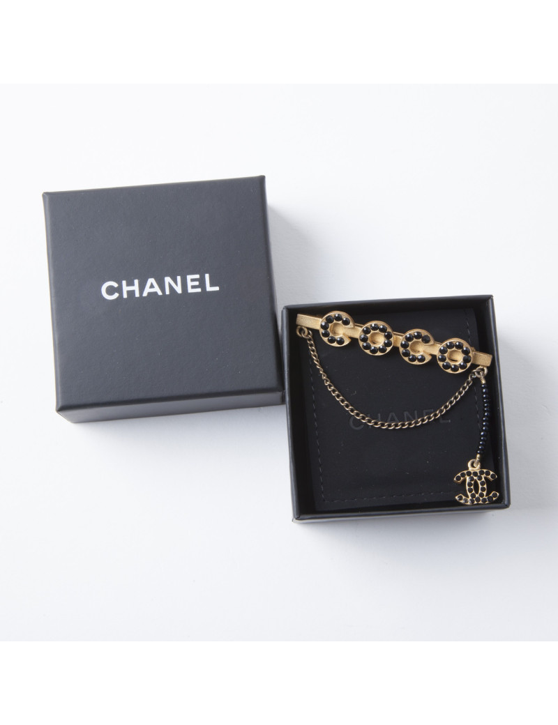 Broche Coco CHANEL dorée avec perles noires