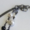 Collier CHANEL double rangs perles nacrées et perles noirs et camélia