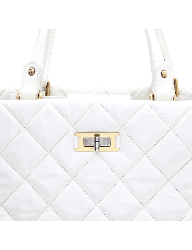 CHANEL tote bag in aged white patent leather