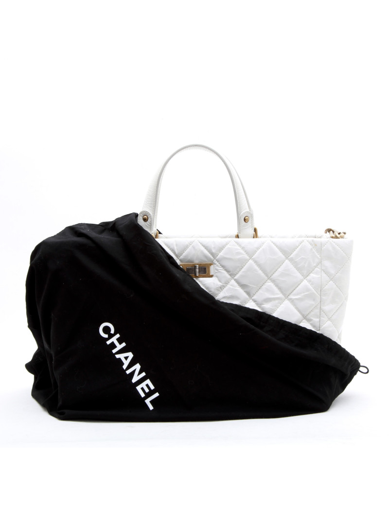 CHANEL tote bag in aged white patent leather