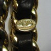 CHANEL vintage gold chain belt interlaced with brown leather.