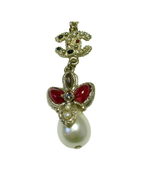 CHANEL pendant necklace in gilded metal and molten glass