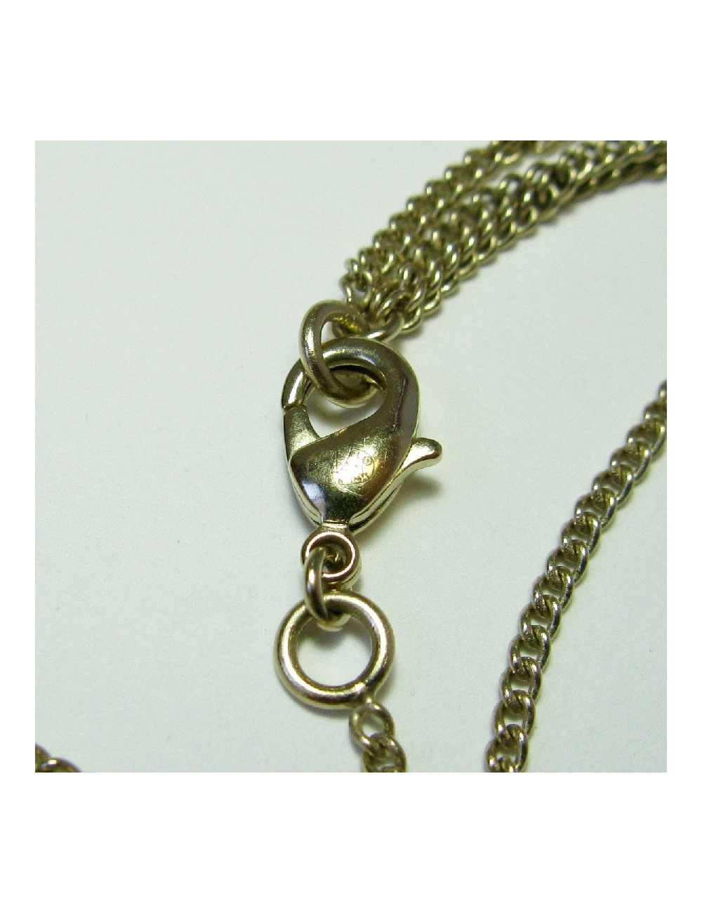 CHANEL pendant necklace in gilded metal and molten glass
