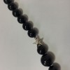 Sautoir CHANEL perles noires et CC dorés