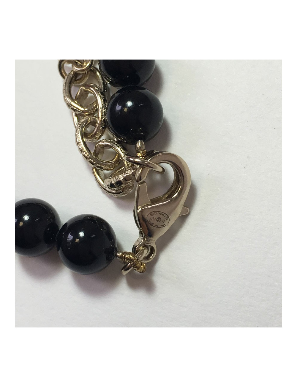 CHANEL Long necklace in black pearls, golden CC and stars