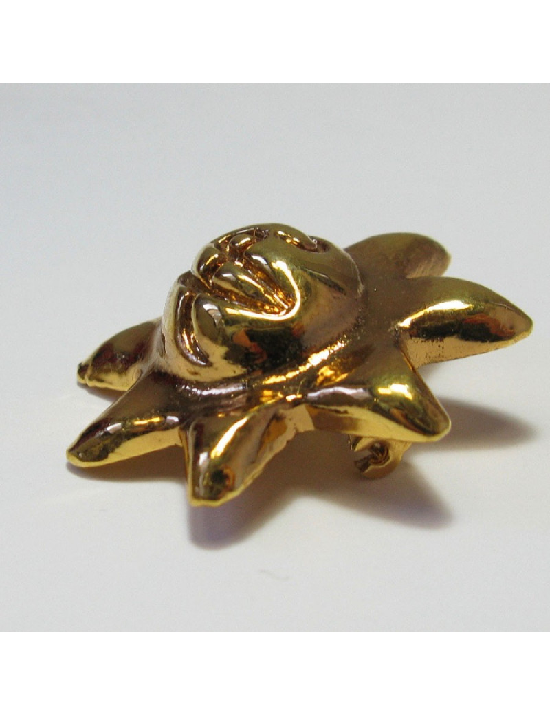 Broche CHRISTIAN LACROIX soleil en résine dorée vintage