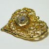CHRISTIAN LACROIX heart brooch in gilded metal and white rhinestone