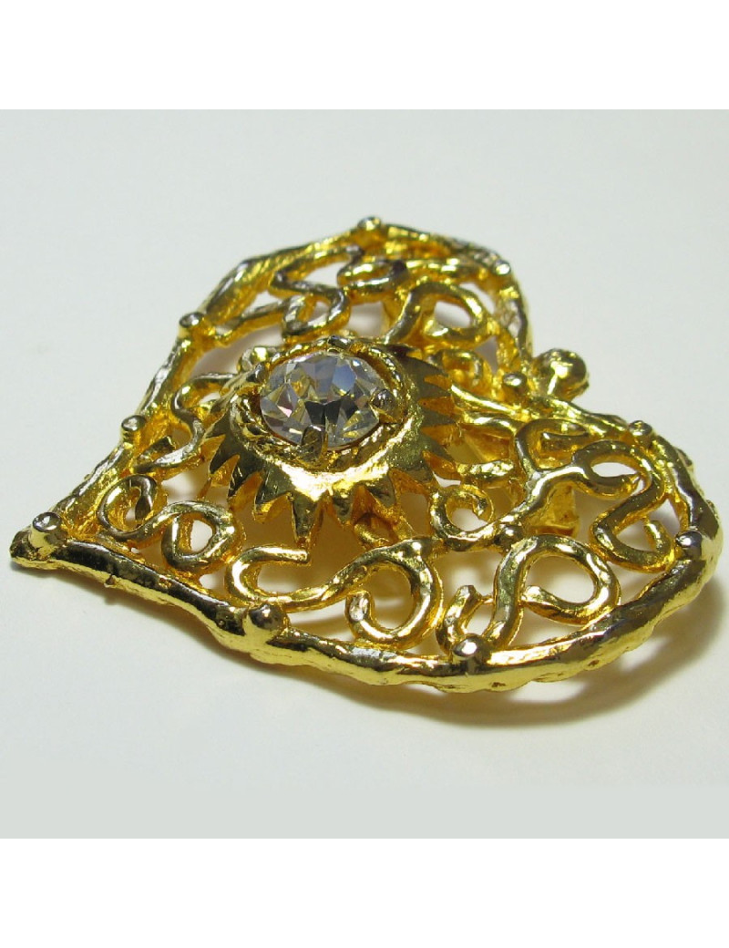Broche CHRISTIAN LACROIX vintage coeur en métal doré serti d'un grand strass blanc au centre