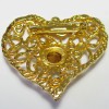 Broche CHRISTIAN LACROIX vintage coeur en métal doré serti d'un grand strass blanc au centre