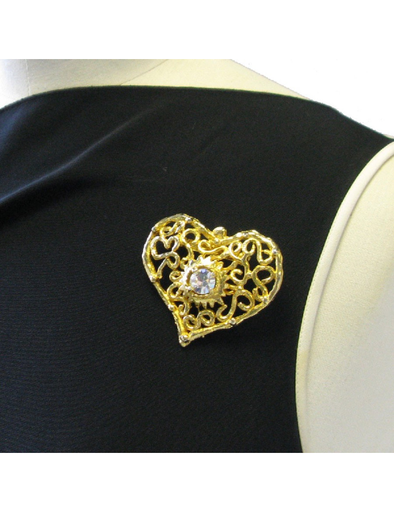 Broche CHRISTIAN LACROIX vintage coeur en métal doré serti d'un grand strass blanc au centre