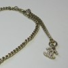 CHANEL necklace in gilded chain and white camellia pendant