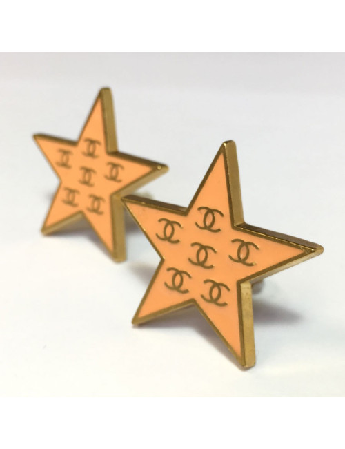 CHANEL star clip-on earrings in gilded metal and coral enamel