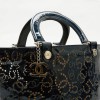 CHANEL bag in perforated navy blue patent leather