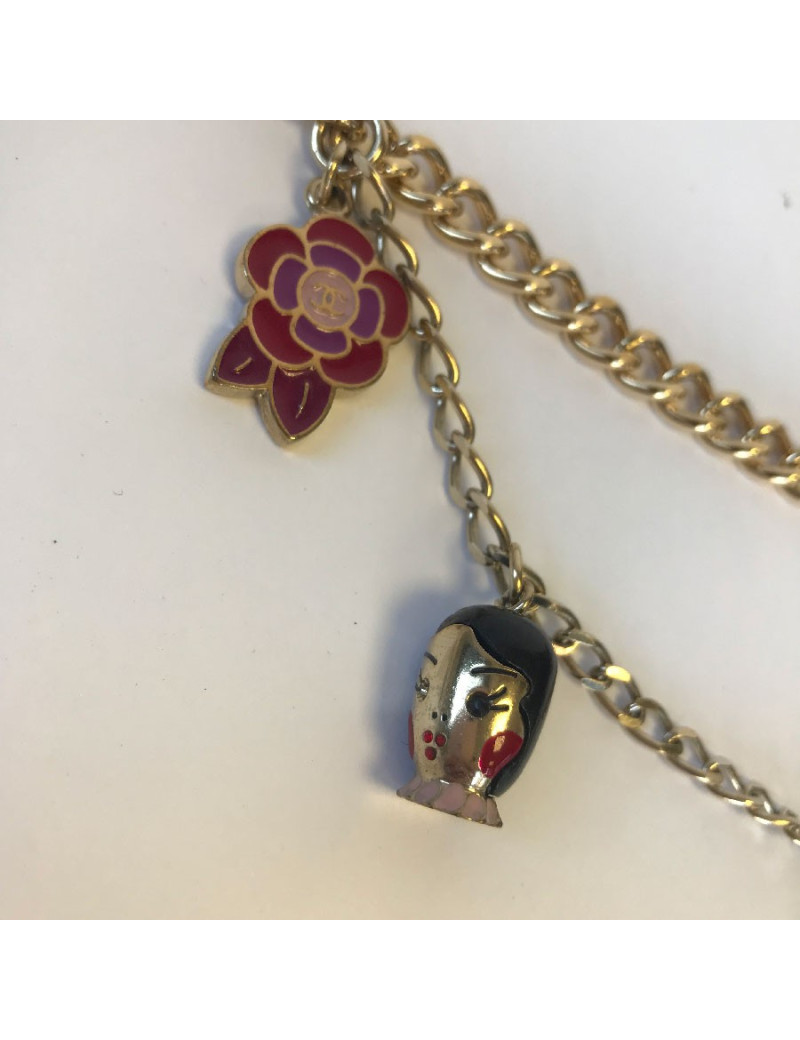 CHANEL "Paris-Shanghai"long necklace belt in gilt metal and charms