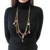 CHANEL "Paris-Shanghai"long necklace belt in gilt metal and charms