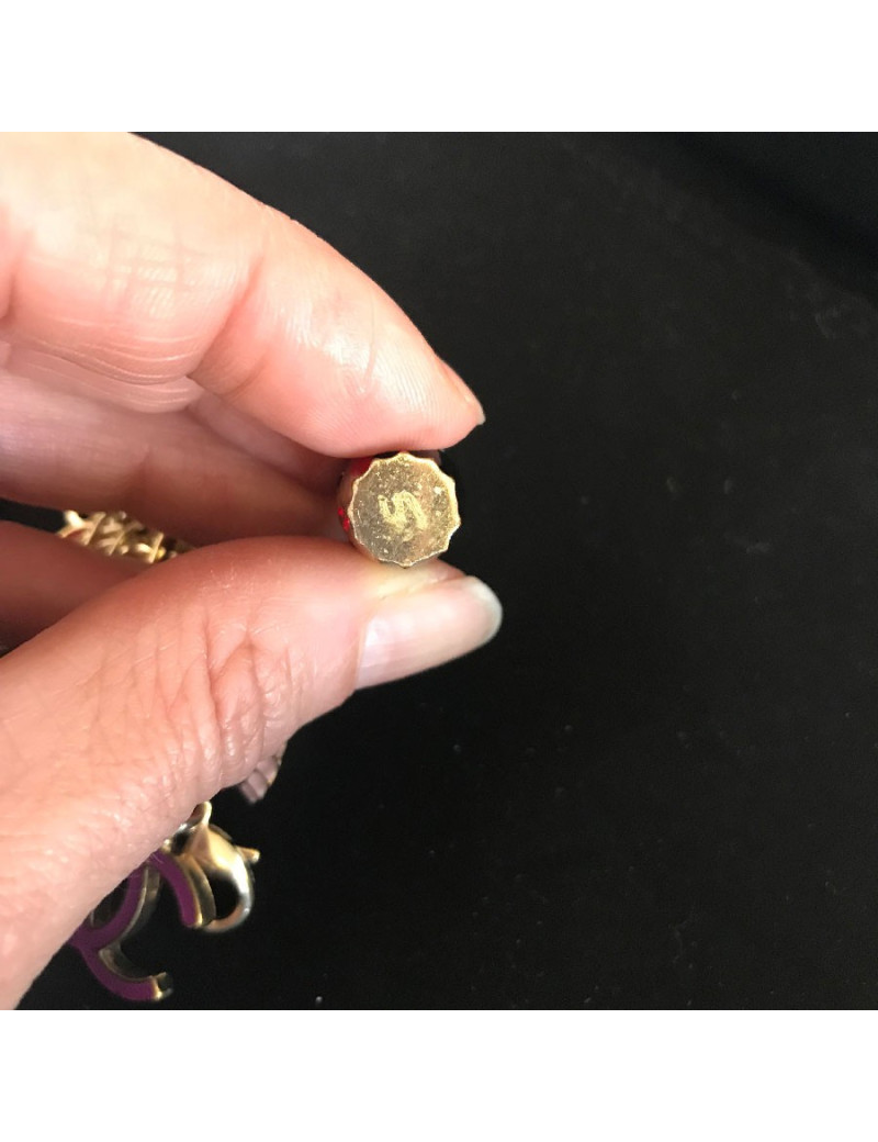 CHANEL "Paris-Shanghai"long necklace belt in gilt metal and charms