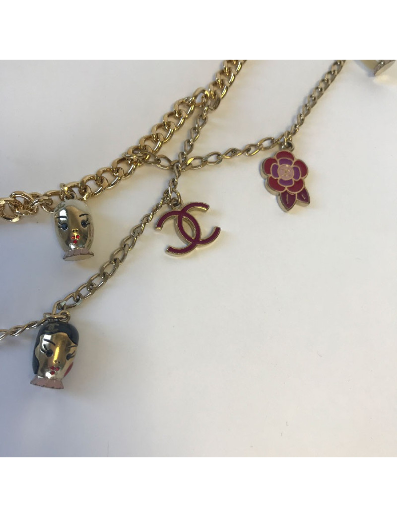 CHANEL "Paris-Shanghai"long necklace belt in gilt metal and charms