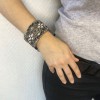 CHANEL Couture articulated cuff bracelet in matte silver metal set with Swarovski rhinestones