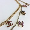 CHANEL "Paris-Shanghai"long necklace belt in gilt metal and charms