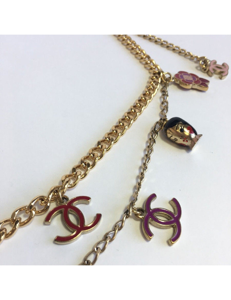 CHANEL "Paris-Shanghai"long necklace belt in gilt metal and charms