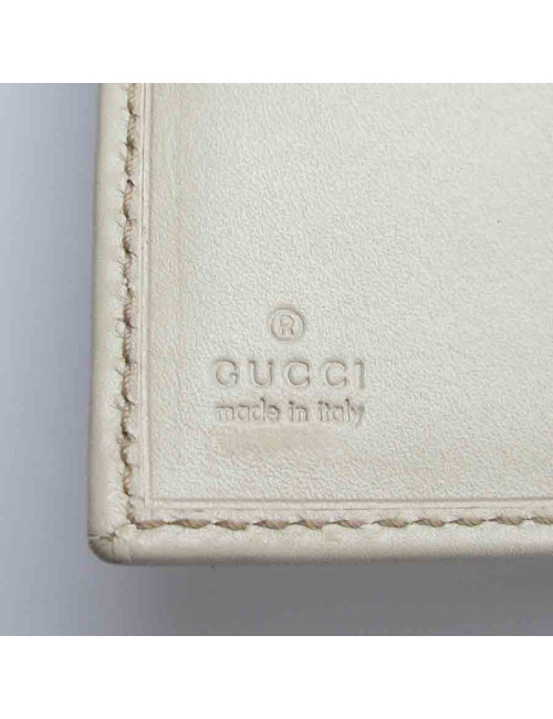 Portefeuille GUCCI cuir embossé GG beige