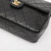 CHANEL vintage mini bag in black quilted lambskin leather