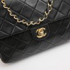 CHANEL vintage mini bag in black quilted lambskin leather
