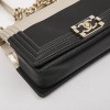 CHANEL Boy bag in black and pale gold smooth lamb leather