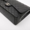 CHANEL maxi Jumbo double flap bag in black quilted caviar leather