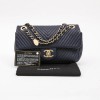 Mini CHANEL bag in blue leather with herringbone patterns